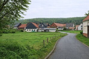 A rural village with houses, a paved road, and a green field. - Apartment Waldeck - comfortable, spacious accommodation in natural surroundings (Twistetal)