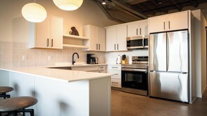 Fridge, microwave, oven, stovetop - Roami at Century Plaza | Convention Ctr |1BR Loft (Minneapolis)