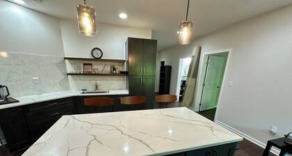 Backyard event space with basement apartment with kitchen, fitness room.