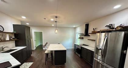Backyard event space with basement apartment with kitchen, fitness room.