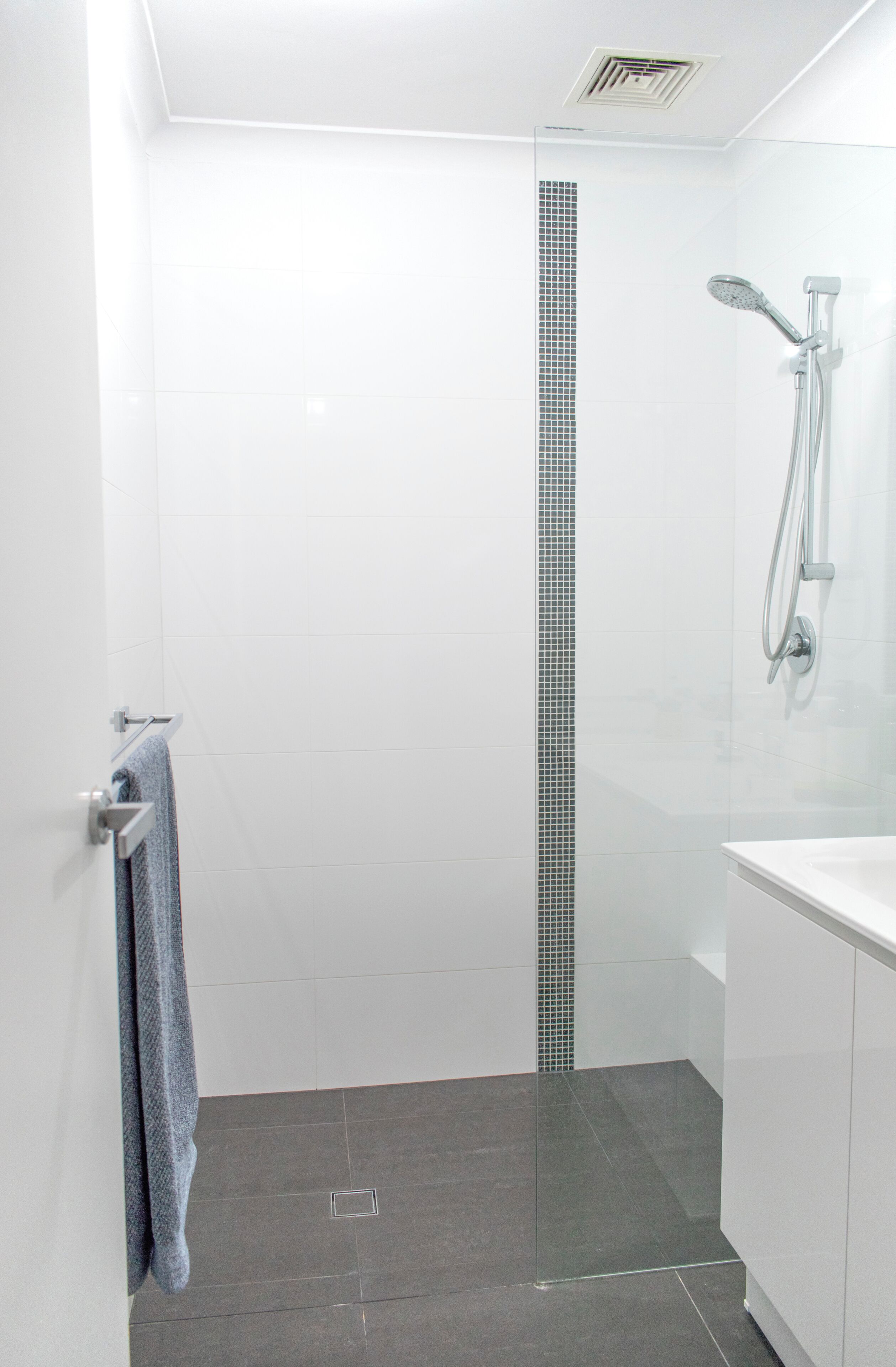 Shower, hair dryer, towels, toilet paper