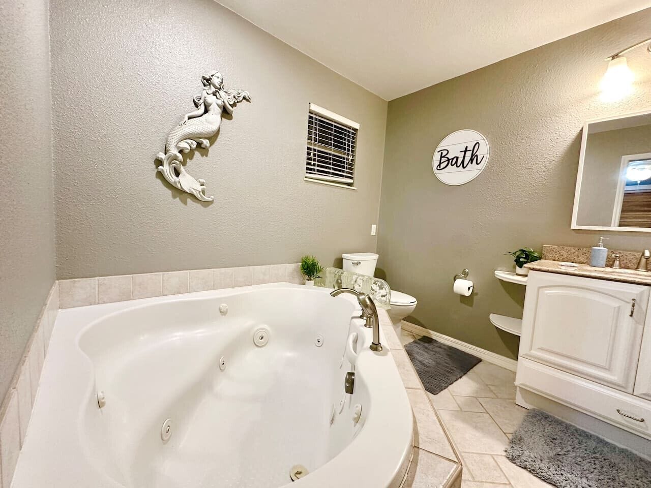 Jetted bath, hair dryer, towels, soap