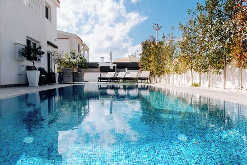 Escape to a stunning luxury villa just a short stroll to the famous Nissi Beach.
