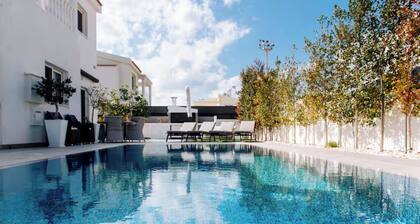 Escape to a stunning luxury villa just a short stroll to the famous Nissi Beach.