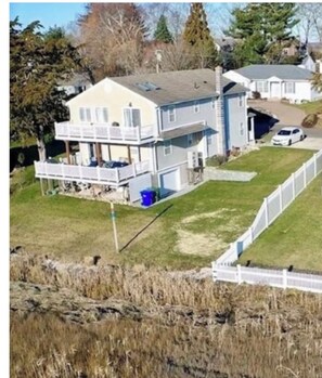 Exterior - Elegant Coastal Retreat  with Stunning Marsh Views and Private Beach-Sleeps 8. (Clinton)