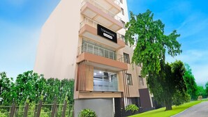 A multi-story building with a sign reading 'TOWNHOUSE 23 Company Service.' - Deluxe With Twin Bed Hotel Amrit Plaza (Dhanbad)