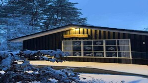 A wooden building with a sign reading 'Sommerhuset' and snow-covered surroundings. - 4 Star Holiday Home in Hadsund (Hadsund)