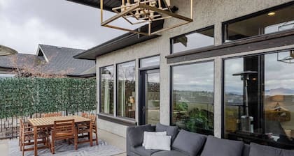 Bright open-concept home in Kelowna with lake views, high ceilings, fireplace, and chefâs kitchen. Enjoy a large deck, spa-like ensuite, and private yard. Minutes away from hikes, beaches, wineries, and downtown.