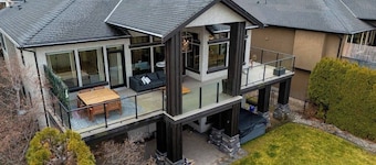 Bright open-concept home in Kelowna with lake views, high ceilings, fireplace, and chef’s kitchen. Enjoy a large deck, spa-like ensuite, and private yard.  Minutes away from hikes, beaches, wineries, and downtown.