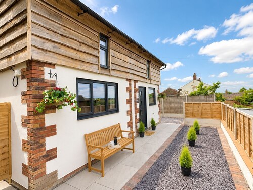 Sleeps 2 in a quiet village location with hot tub and garden