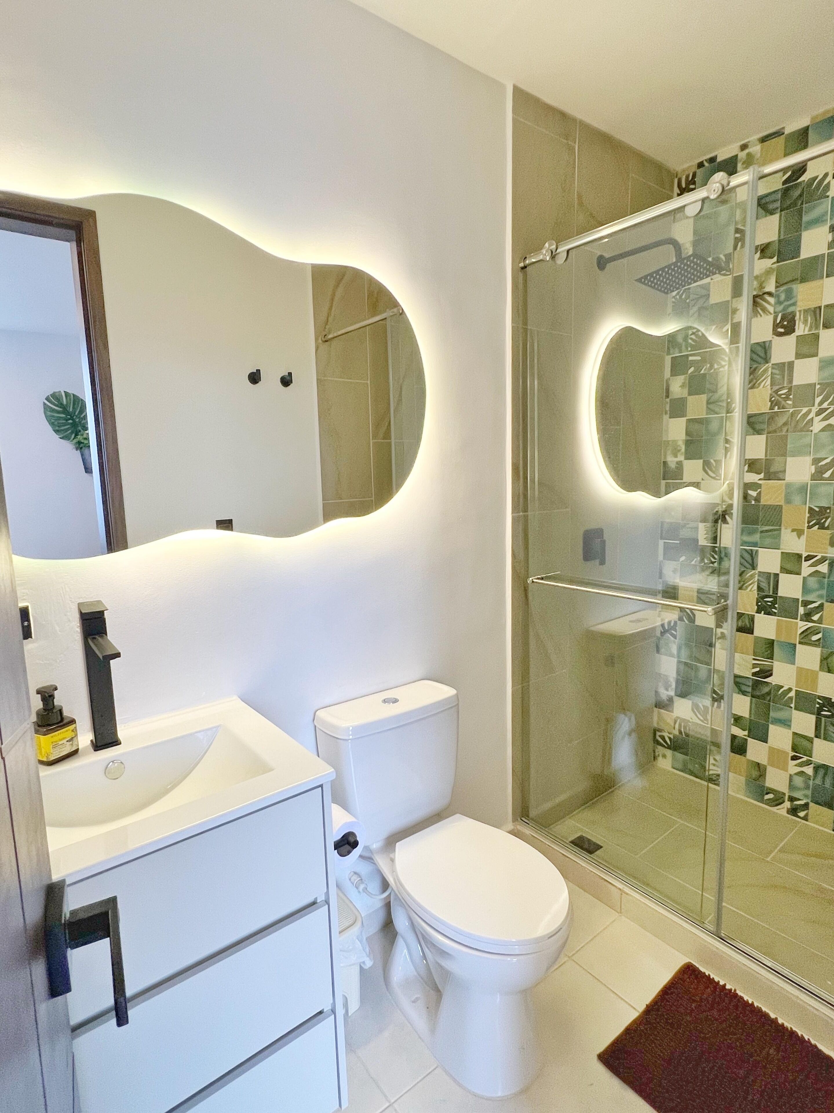 Shower, hair dryer, towels, toilet paper