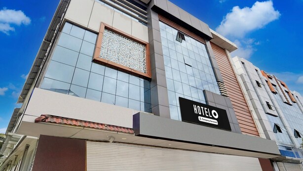 A modern hotel building with a prominent sign reading 'HOTEL O'.