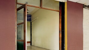 A doorway leading into a building with a sign indicating a police station.