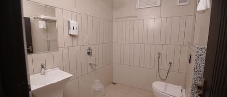 Separate bathtub and shower, towels, soap, shampoo