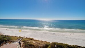 A beach with a clear sky, a flag, and a pathway leading to the water. - Close to Beach, Gated Community, Sea-Esta Villa on 30A, Golf Cart Included (Santa Rosa Beach)