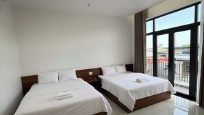 A hotel room with two beds, a large window, and a view of the city. - THIÊN PHÚC HOTEL (Nghia Lo)