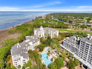 A resort with multiple buildings, a swimming pool, and a golf course. - Elegant Baytowne Wharf Luxury Getaway (Miramar Beach)