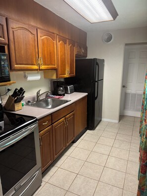 Suíte conforto, 1 quarto, cozinha | Cozinha privada