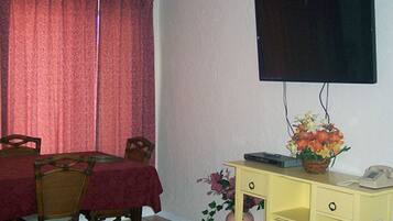 Suíte conforto, 1 quarto, cozinha | Parte interna