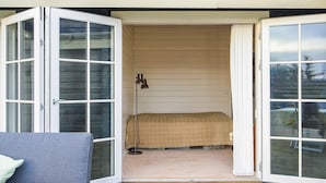 A room with a bed, a window, and a door. - 4 Star Holiday Home in Korsor (Korsor)