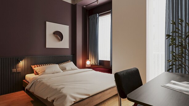 A modern hotel room with a bed, bedside table, chair, and a window with curtains. - The Rare Rooms by The Bloom - Saigon (Ho Chi Minh City)