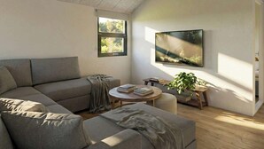 Ein modernes Wohnzimmer mit einem Ecksofa, einem runden Couchtisch, einem Flachbildfernseher, einem Fenster und einer Topfpflanze.