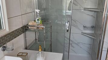 Shower, hair dryer, towels, soap