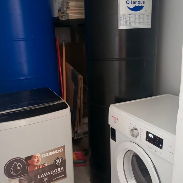A laundry room with a washing machine and a dryer.