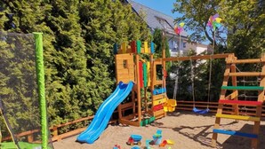 A playground with a slide, climbing structures, and sand. - Willa Balticus Władysławowo (Władysławowo)