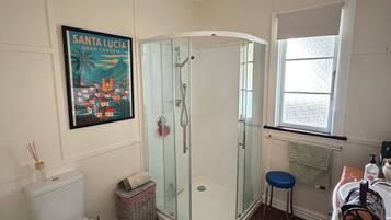 Shower, towels, soap, toilet paper