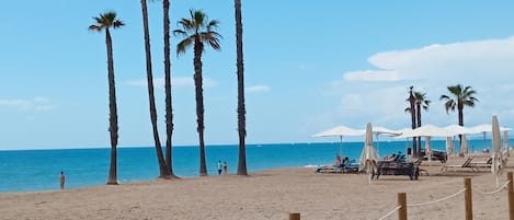 On the beach, sun loungers
