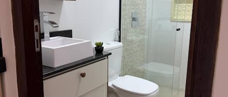 Shower, hair dryer, towels, toilet paper