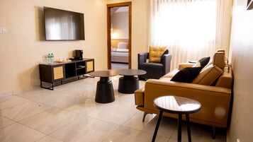 Luxury Apartment | Living area | 40-inch Smart TV with cable channels