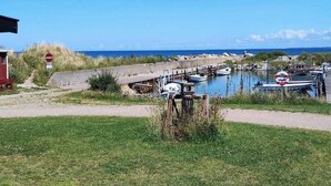 A coastal area with a no-entry sign, boats docked, and a clear view of the sea. - 4 Star Holiday Home in Nykobing Sj (Nykobing Sjaelland)