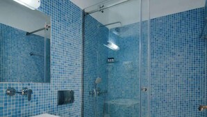A bathroom with a glass-enclosed shower, a white sink, and a toilet. - Central sunset view #1 (Himarë)