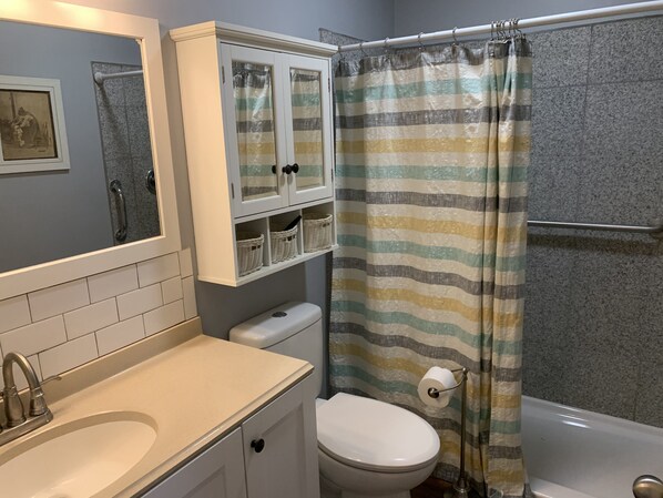 Shower, hair dryer, towels, toilet paper