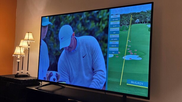 A television displaying a golf game with a player and a golf course layout. - Beautiful 4BR/3BA Fully Furnished Home in Quiet Neighborhood (Evans)