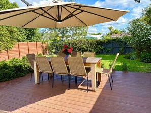 Outdoor dining - Marigold House - Tropical Getaway w/large yard & heated pool 2 mi from the beach (Oakland Park)