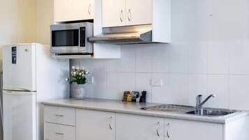 Deluxe Double Room, Balcony, River View | Private kitchen