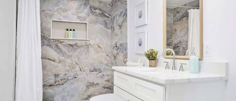 Shower, hair dryer, towels, shampoo