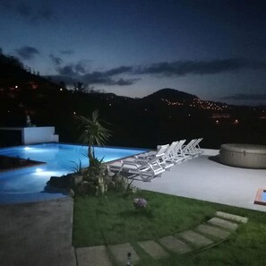A swimming pool with lounge chairs and a stone pathway. - Ocean Heated Pool Jacuzzi View 2 Terraces Flat102 (Santa Cruz)