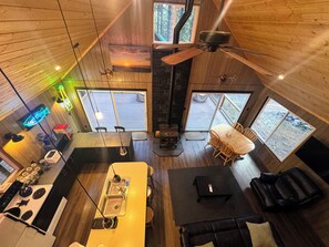 A cozy cabin interior with a kitchen, dining area, and a fireplace. - Our Family Cabin!  Getaway from town - Gateway to adventure - Space to reconnect (Cle Elum)
