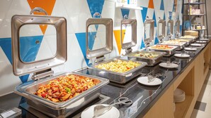 A buffet with multiple serving stations, each with a metal serving tray and a spoon. - H Crytal Hotel (Jinma Road, Dalian Development Zone) (Dalian)