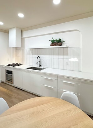 Microwave, oven, dishwasher, paper towels - masterfully blend modern luxury studio with thoughtful details (Los Angeles)