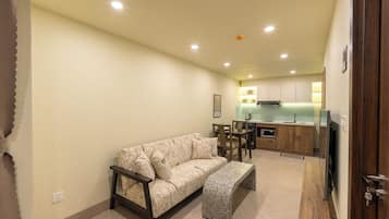 Apartment, 1 King Bed | Living area | 43-inch LCD TV with digital channels