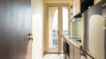 Family Apartment, 1 Bedroom, City View | Private kitchen | Mini-fridge