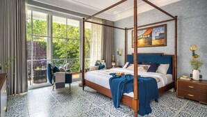 A four-poster bed with a view to the outdoors, a dining area with a table and chairs, and a large window with curtains. - ELIVAAS Prive Suntuarios Ikkebana 4 BHK  (Assagao)