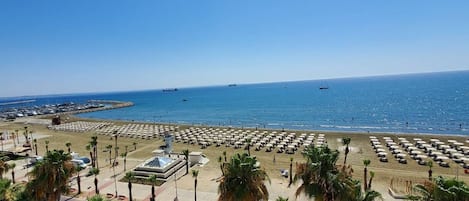 On the beach, sun-loungers, beach umbrellas