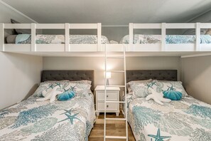 A bunk bed room with a nightstand, starfish pillows, and a ladder. - Bayside Waterfront Retreat in Ocean City! (Ocean City)