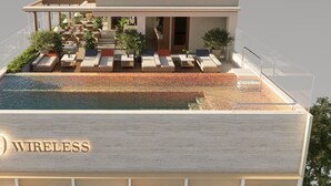 A rooftop pool area with lounge seating and a sign reading '39 WIRELESS.' - 39 Wireless Hotel (Bangkok)